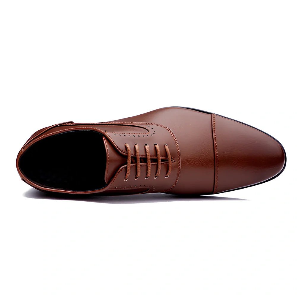 Men's black casual leather shoes with low-top design and visible sewing lines on PU leather upper