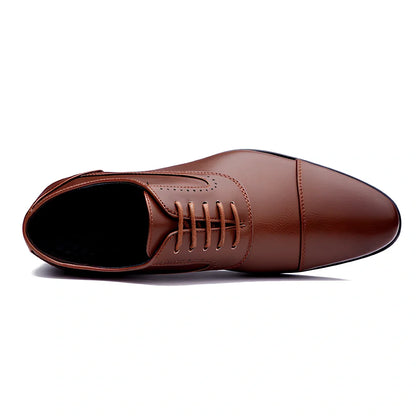 Men's black casual leather shoes with low-top design and visible sewing lines on PU leather upper