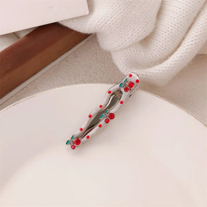 Red love heart-shaped hair barrette clip with retro white dots on a willow leaf-shaped base.