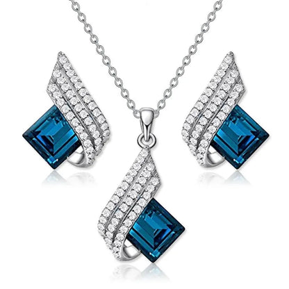 Necklace and earring set with alloy pendant and cross chain in two colour options.