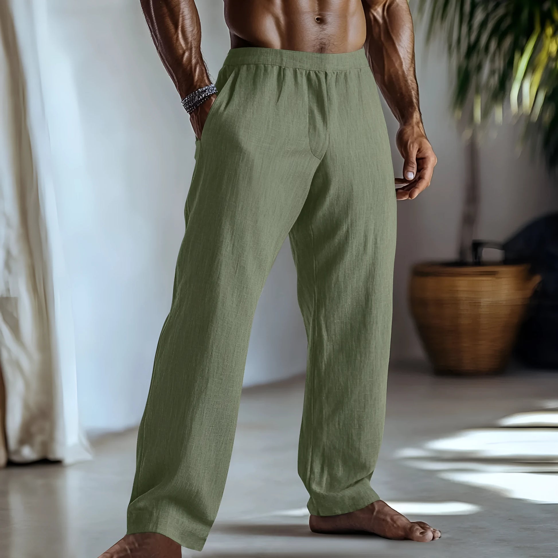 Straight leg cotton linen trousers in light green, shown with side pockets and a casual fit.