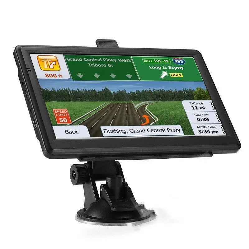 Black portable 7 inch car GPS navigation device with bracket and car charger on a dashboard.