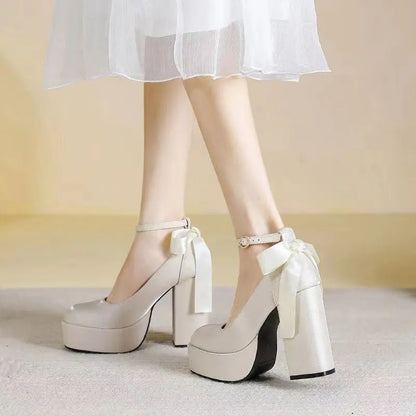 Women's waterproof wedding pumps with chunky heel in wine red colour featuring silk buckle detail