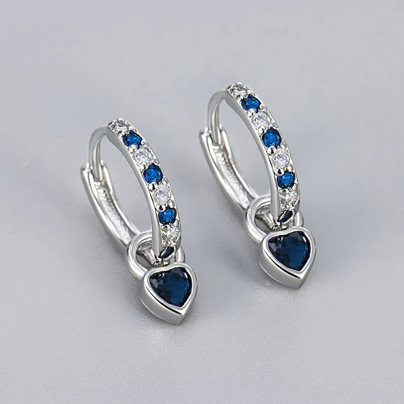 Women's fashion earrings with heart-shaped eardrops, diamond-treated gemstones in gold or white gold plating, approximately 2.5 cm long