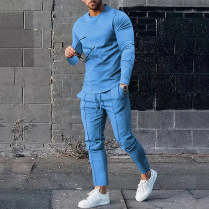 Men's solid colour two-piece lounge suit with long sleeve T-shirt and trousers in light grey.