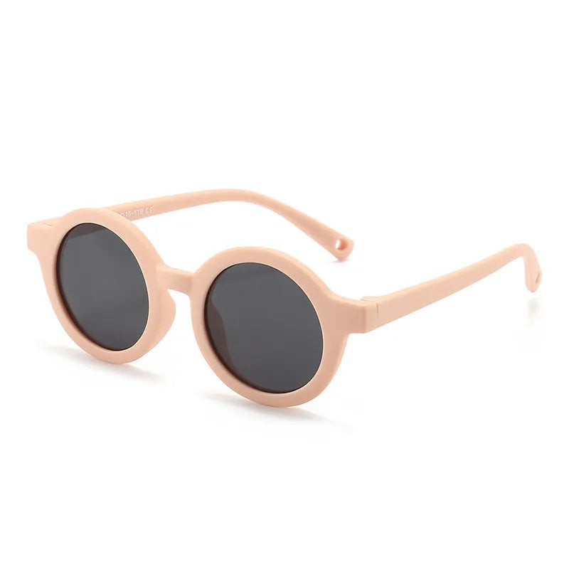 Children's round-frame polarised sunglasses with soft TPEE frame for ages 0-3, shown in assorted colours.