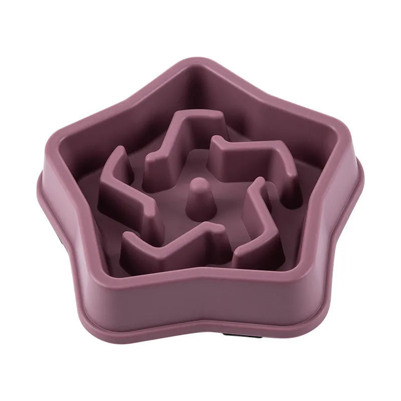 Yellow plastic slow feeding dog bowl with raised obstacles at base to prevent choking