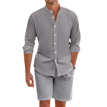 Man wearing a light blue short sleeve lapel shirt and matching drawstring shorts from a summer shirt suit.