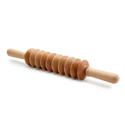 Wooden massage roller set with beechwood T-shaped roller, straight, curved and round massagers on a table.