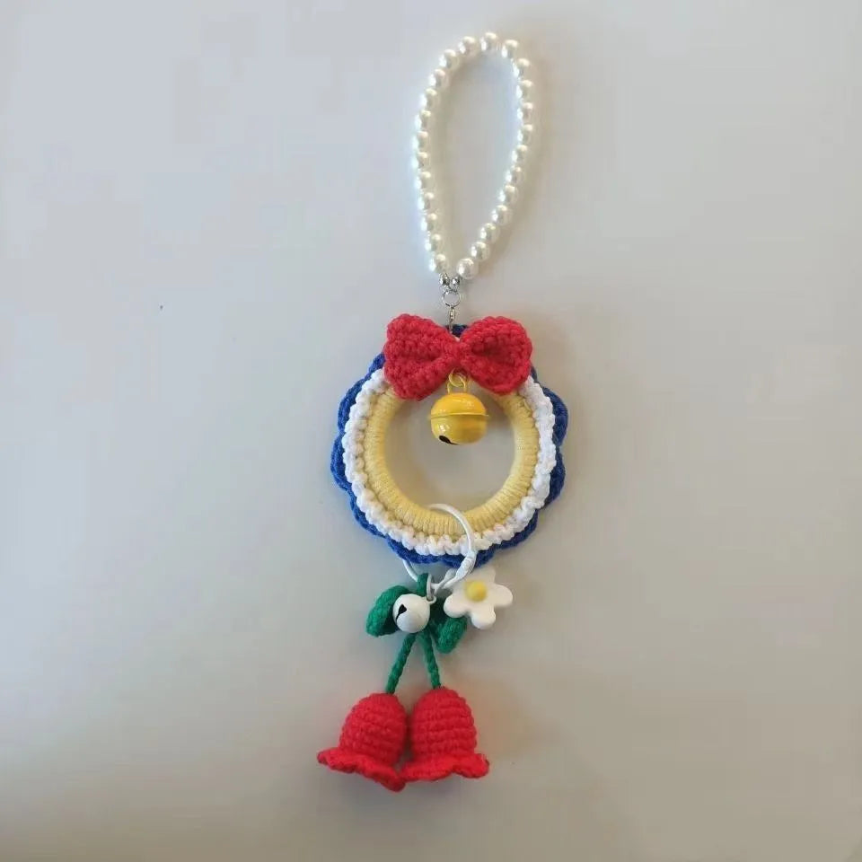 Handmade Snow White plush yarn car hanging ornament, shown as a pendant, with option for red wind chimes.