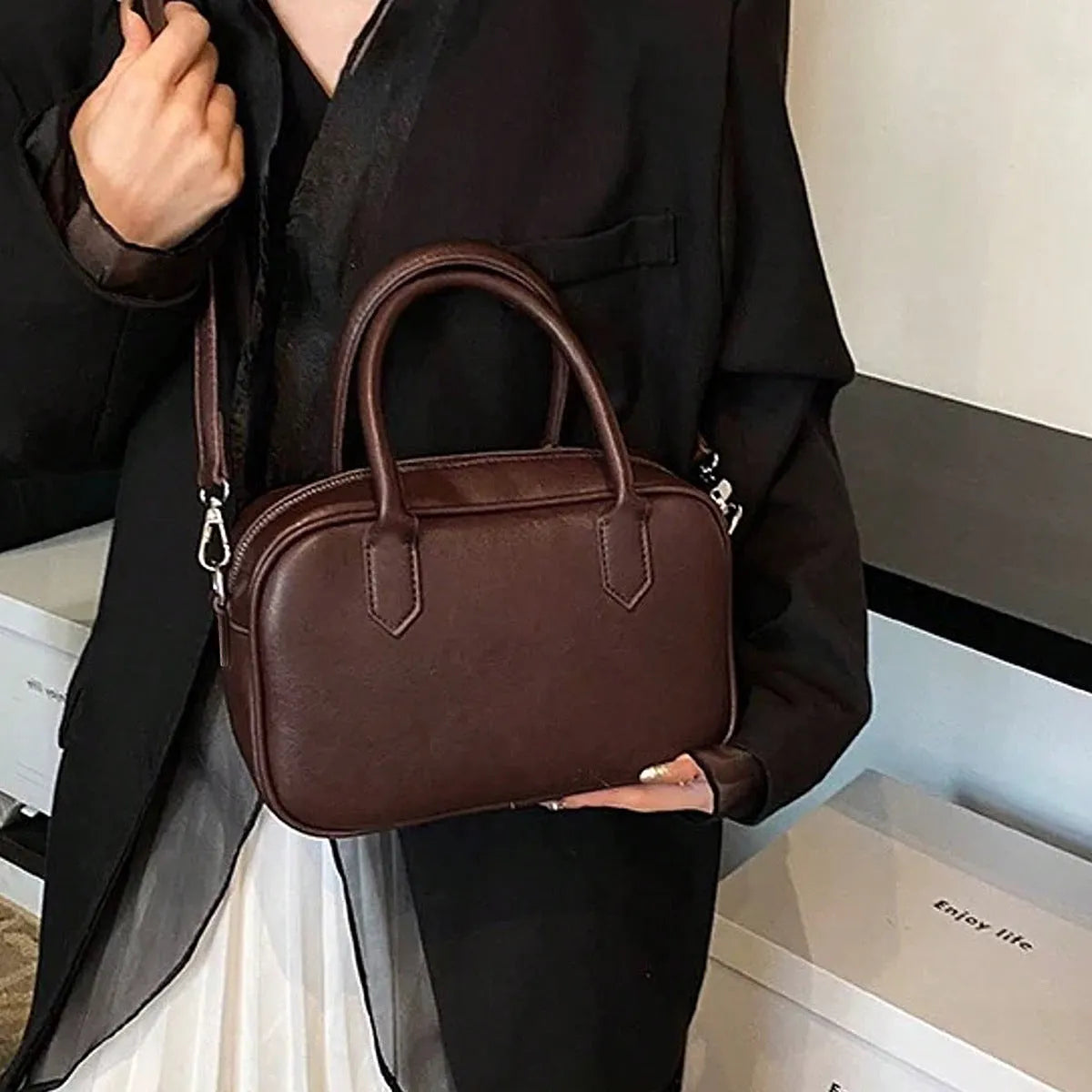 Small square retro messenger bag with single shoulder strap in black or coffee colour