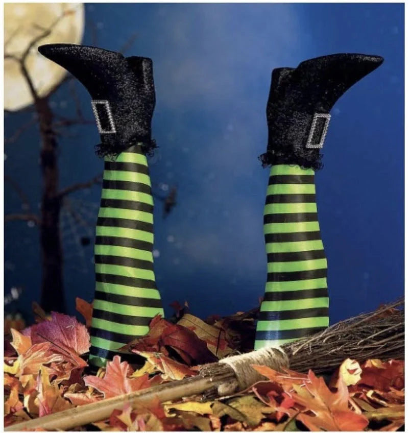 Halloween witch leg garden decoration with striped stockings and black boots