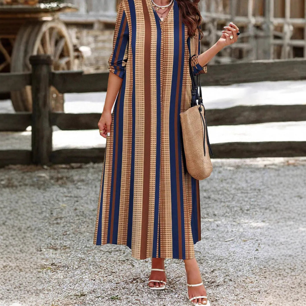 Camel coloured vertical striped V-neck knitted long sleeve dress on a hanger.