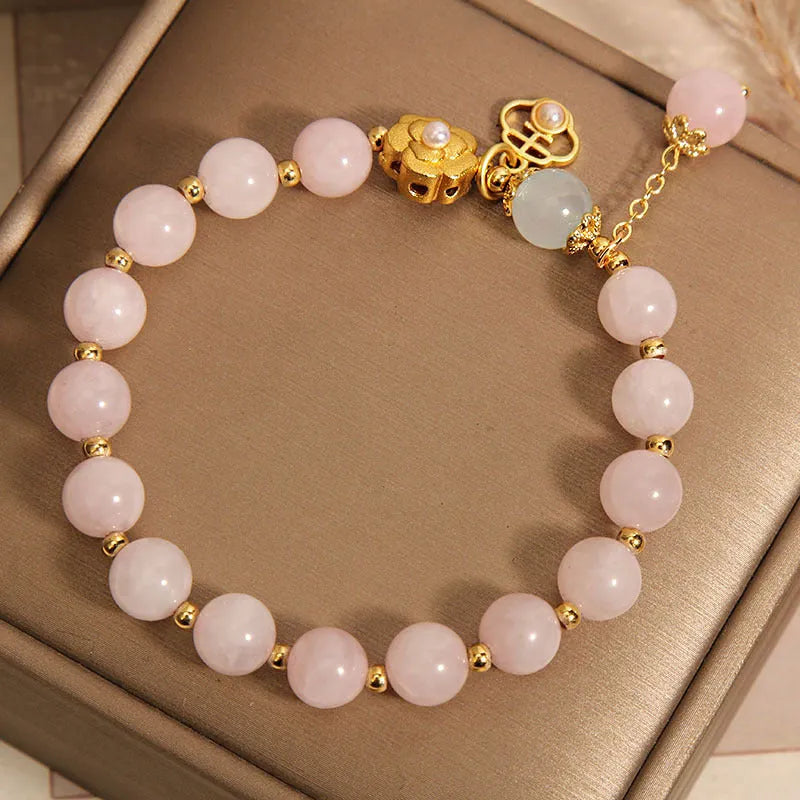 Women's pink crystal flower bracelet with adjustable sizing and refined grace floral design
