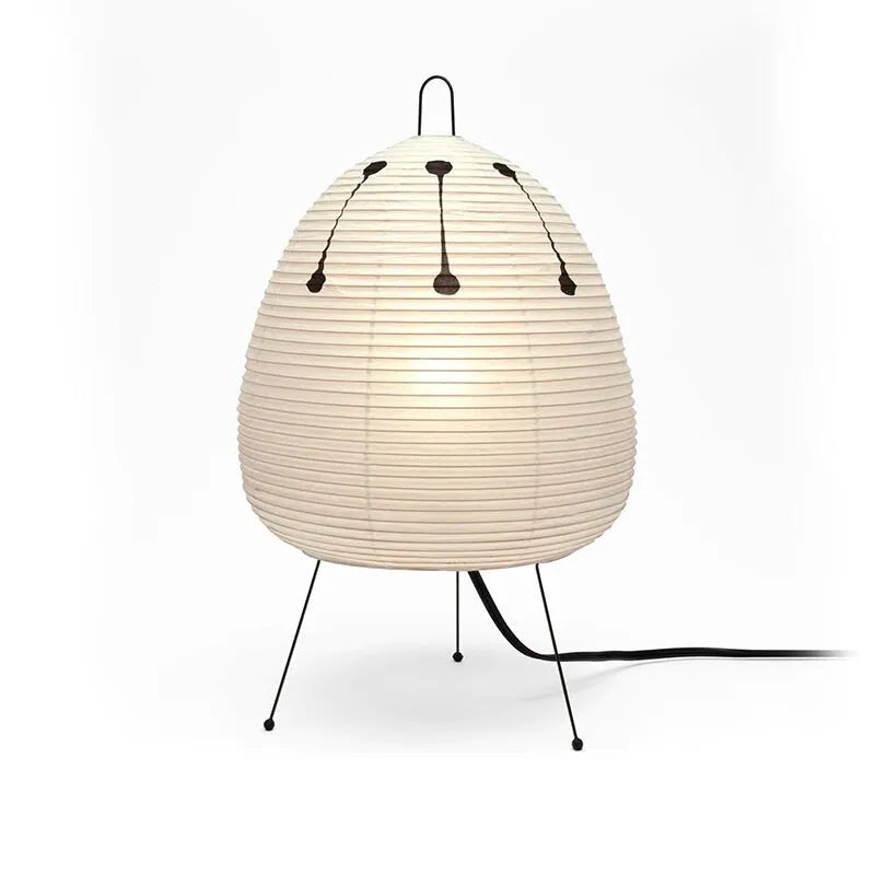 Japanese style table lamp with a white handmade rice paper shade on a slim aluminium base.