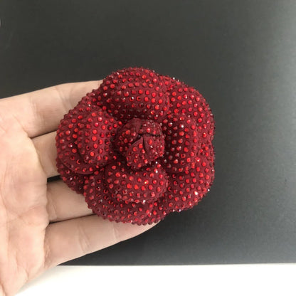 Leather shoe ornament brooch with decorative elements set in flower bottom design