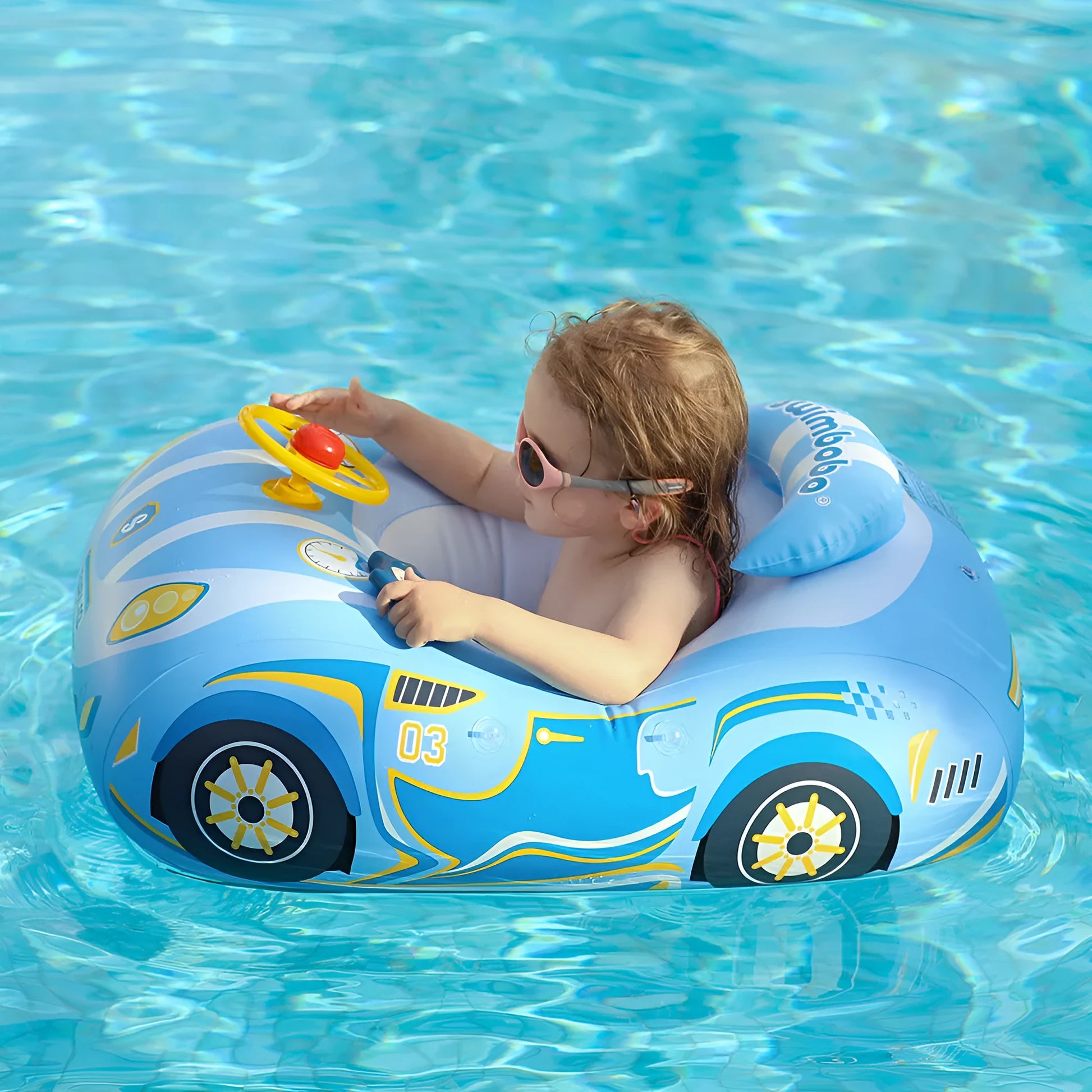 Pink inflatable swimming ring for children with a cartoon car steering wheel design.