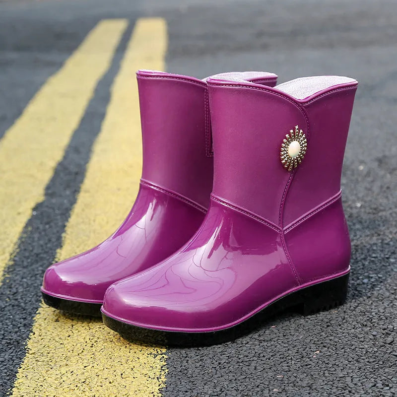 Women's mid-calf rain boots in beige, black, or purple with a non-slip sole.