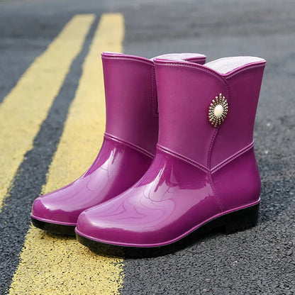 Women's mid-calf rain boots in beige, black, or purple with a non-slip sole.