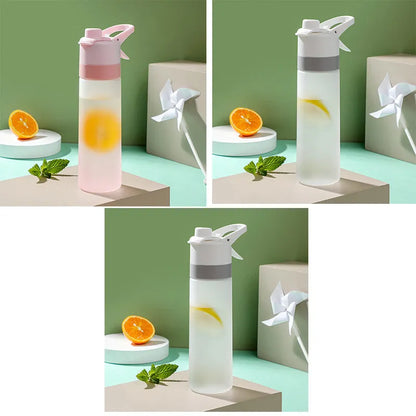 White spray water bottle with black leakproof lid and handle strap on a table