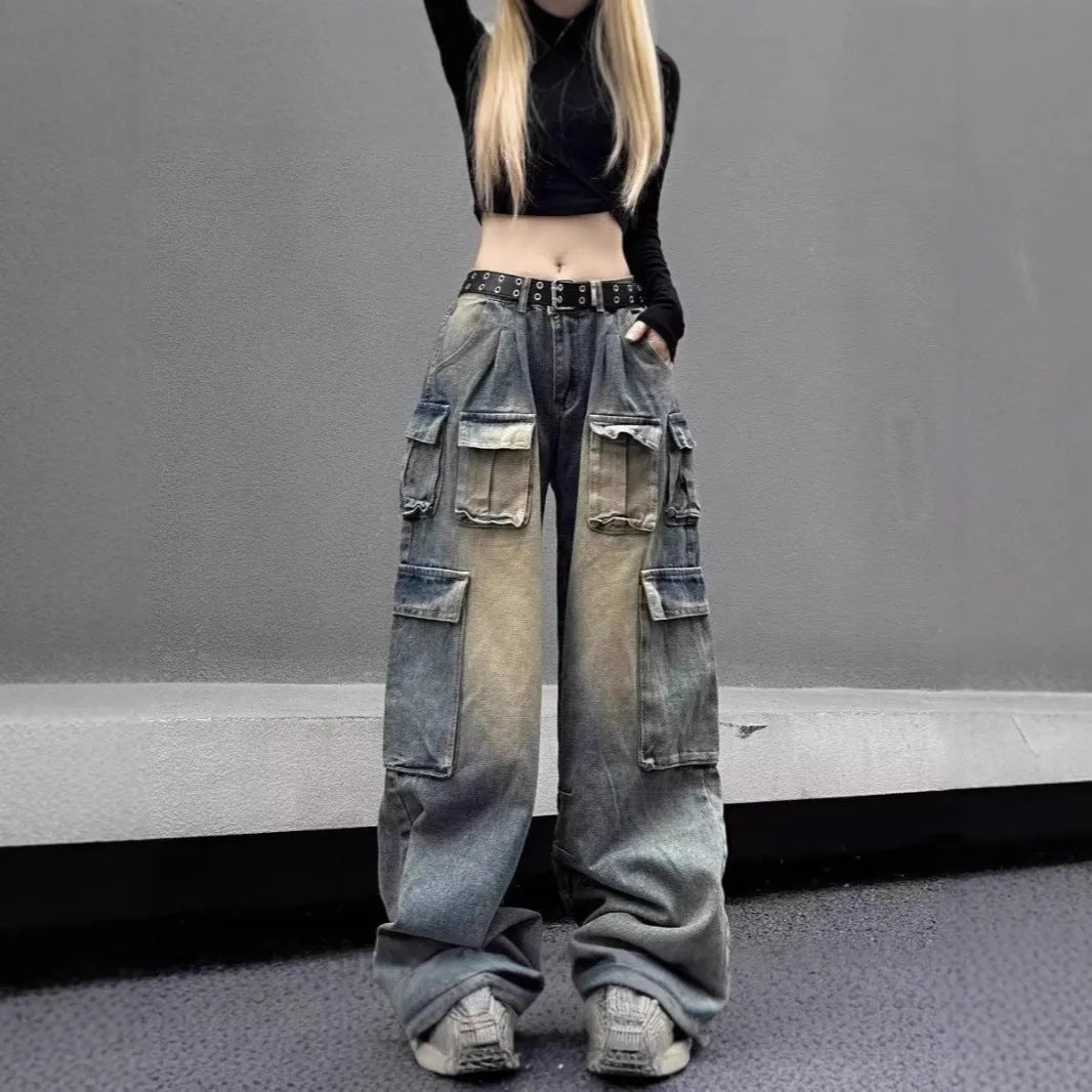 Men's loose straight-leg distressed jeans with multiple tooling pockets in light blue denim