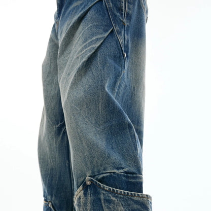Men's verdant blue jeans with burst pattern, curved knife cut, and loose fit design