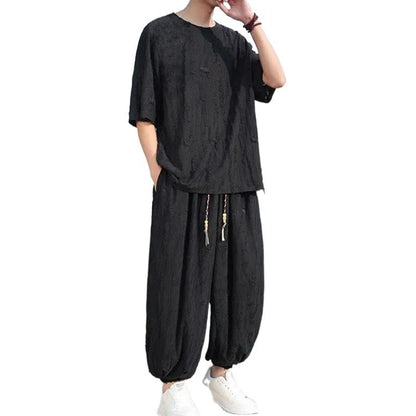 Men's thin knit two-piece suit with half-sleeve top and cropped trousers in black or grey colour options