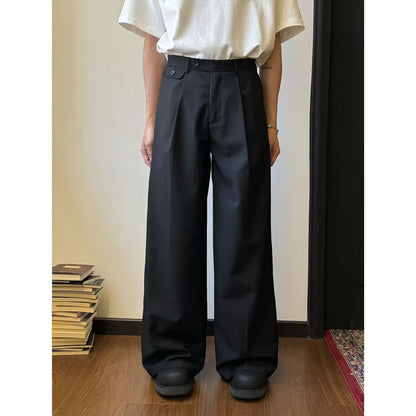 Man wearing straight-leg wide-leg casual trousers in brown, showcasing the relaxed drape and fit.