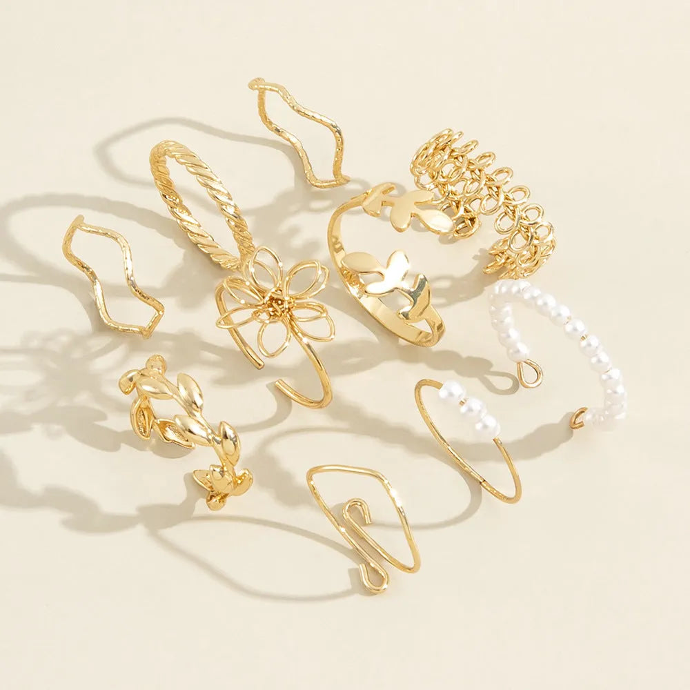 Gold openwork flower pattern ring set with electroplated glossy finish