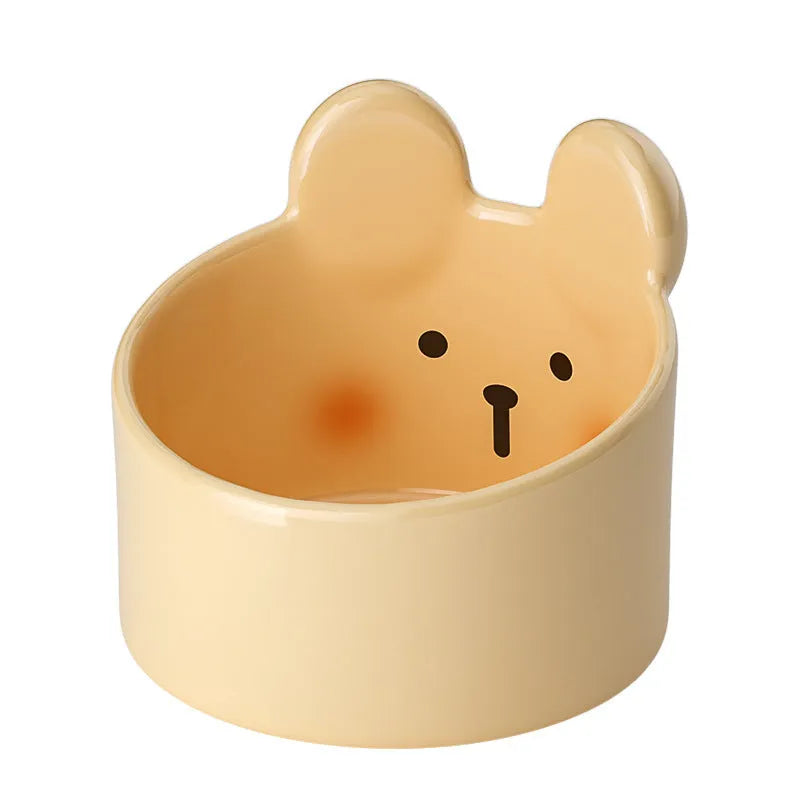Blush Critter ceramic pet bowls in white rabbit and brown bear designs, showing neck protection rim.