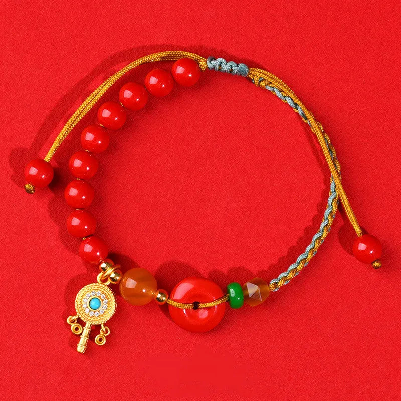 Hand-woven cinnabar peace blessing bracelet in emperor red sand colour with geometric design