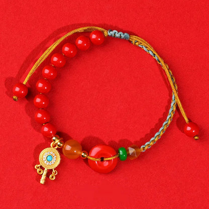 Hand-woven cinnabar peace blessing bracelet in emperor red sand colour with geometric design