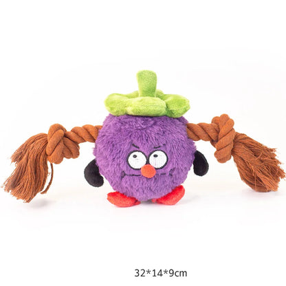 Green and purple plush dog toy with a central rope knot for tugging and chewing.