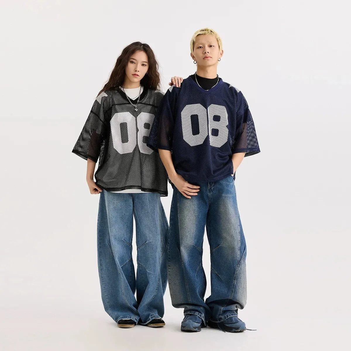 Black half sleeve loose fit shirt with white letter print, short sleeves, pullover style.