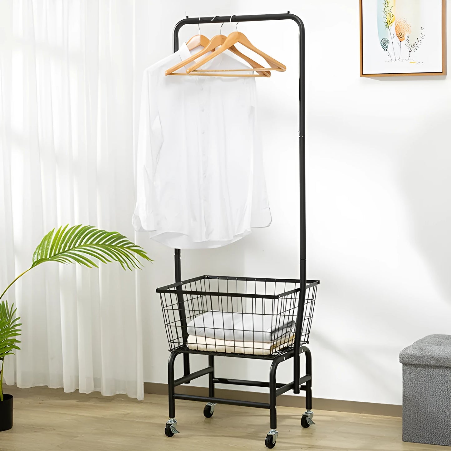 White freestanding mobile clothes rail with a single hanging rod, four casters, and an integrated pulley system.