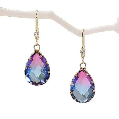 Coloured glass crystal heart-shaped earrings for women in blue, yellow, purple, and red styles.