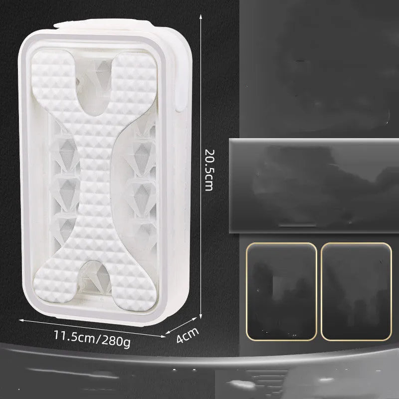 Light grey silicone ice ball mould and water bottle with lid on a kitchen counter.
