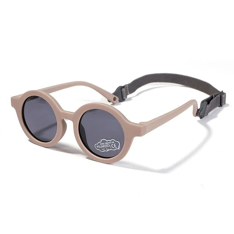 Children's round-frame polarised sunglasses with soft TPEE frame for ages 0-3, shown in assorted colours.