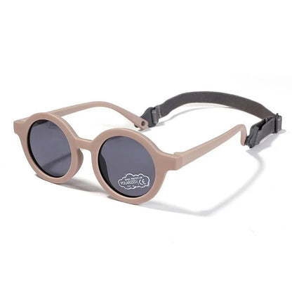 Children's round-frame polarised sunglasses with soft TPEE frame for ages 0-3, shown in assorted colours.