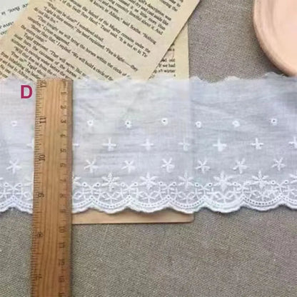 Cotton embroidered lace trim ribbon showing floral cutout patterns in four different width styles