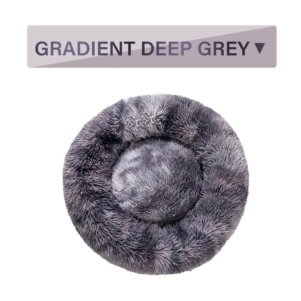 Fluffy donut-shaped pet bed with raised bolster edge in long plush material