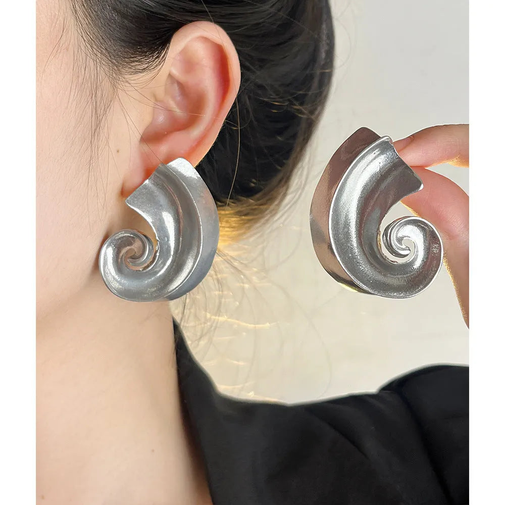 Gold and silver retro geometric alloy ear studs on a white background.