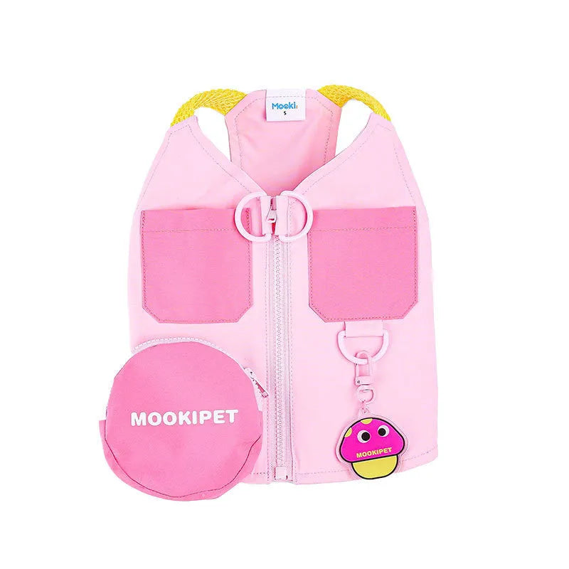 Pink polyester dog vest harness on a small white dog, showing back traction loop and casual fit.
