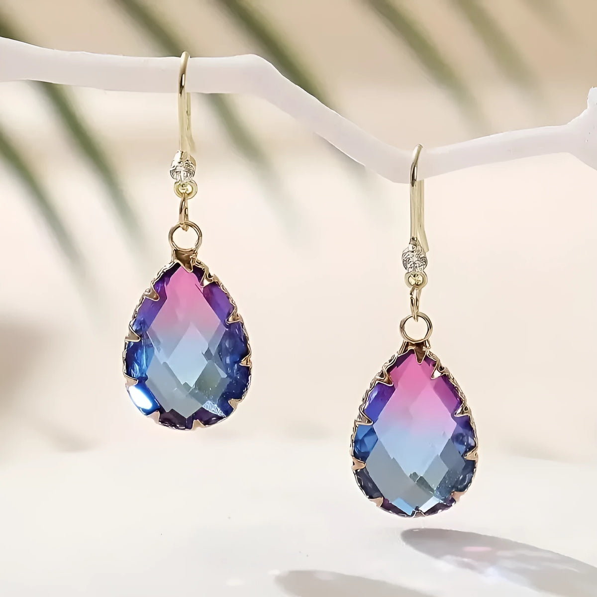Coloured glass crystal heart-shaped earrings for women in blue, yellow, purple, and red styles.