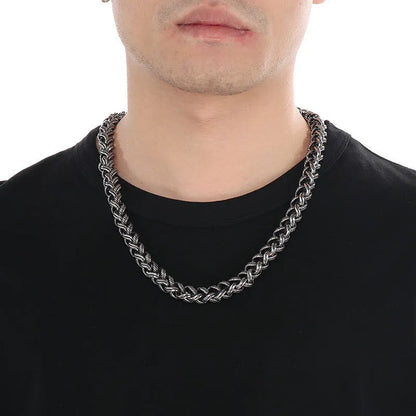 Men's antique silver titanium steel keel chain necklace with large geometric links on a black background.