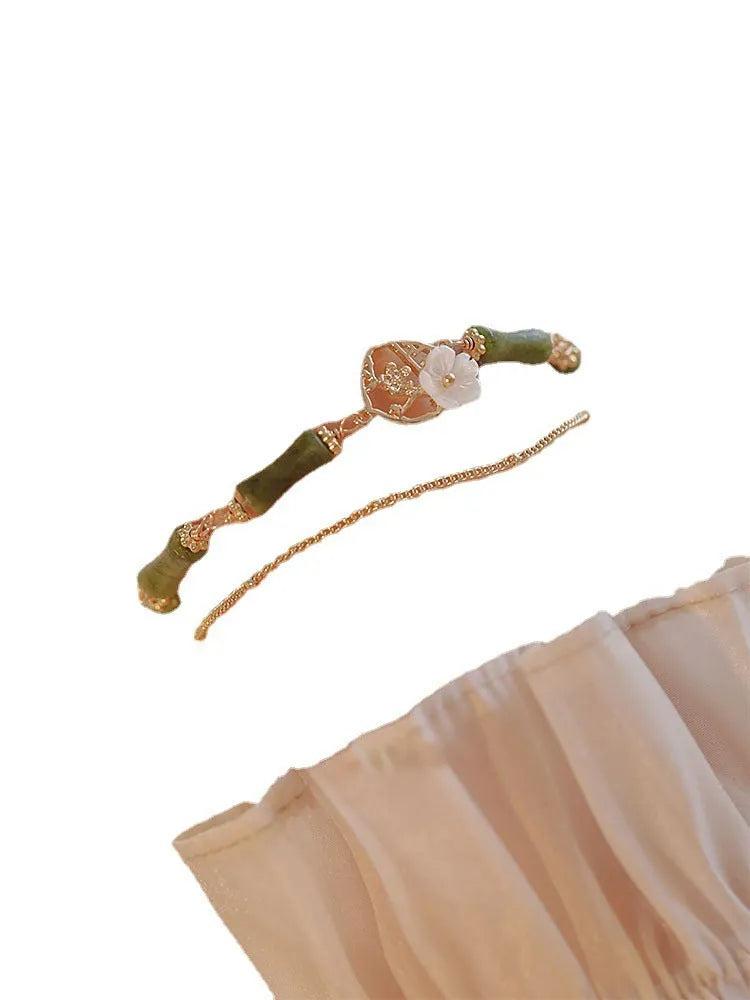 Natural olivine bracelet with Chinese double layer design featuring twin bells of Ireland olive branch elements