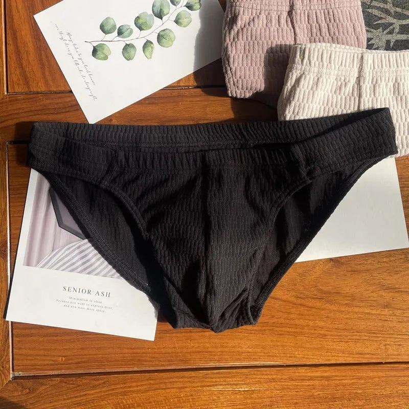 Men's solid colour pure cotton triangle underwear briefs on a mid-waist fit model