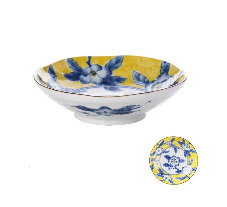 Yellow ceramic tableware set with colourful floral patterns, includes bowls and plates in Japanese style