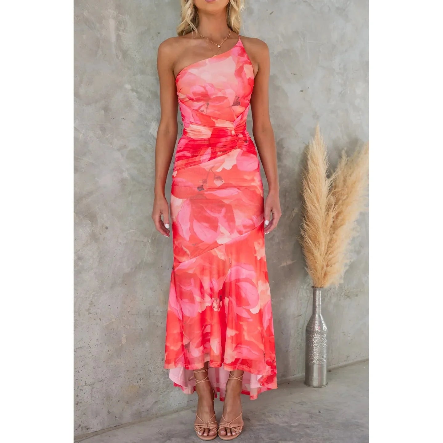 Elegant floral one-shoulder summer dress with suspender detail in vibrant colours