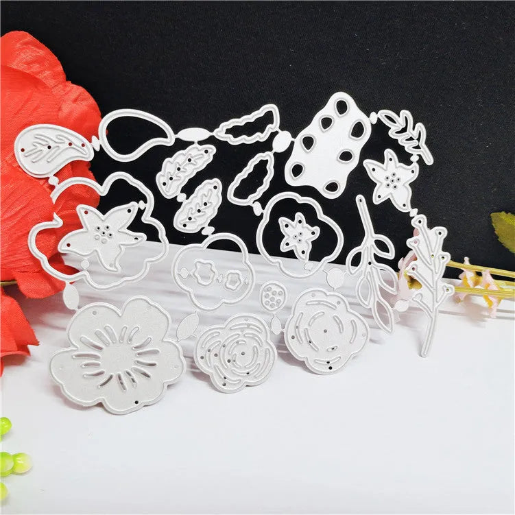 Silver carbon steel floral cutting die for paper crafts measuring 14.3 by 9.9 cm.